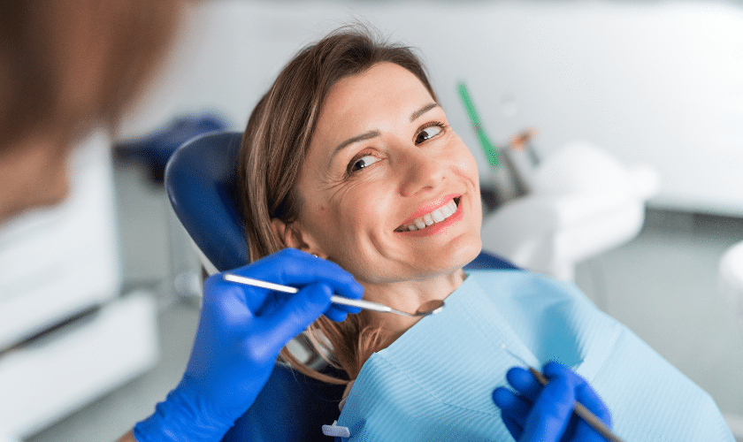 Patient smiling in dental chair during orthodontic consultation in Woodbury, MN.