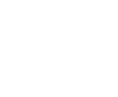 Professional orthodontist in white coat examining patient's teeth in modern dental office setting.